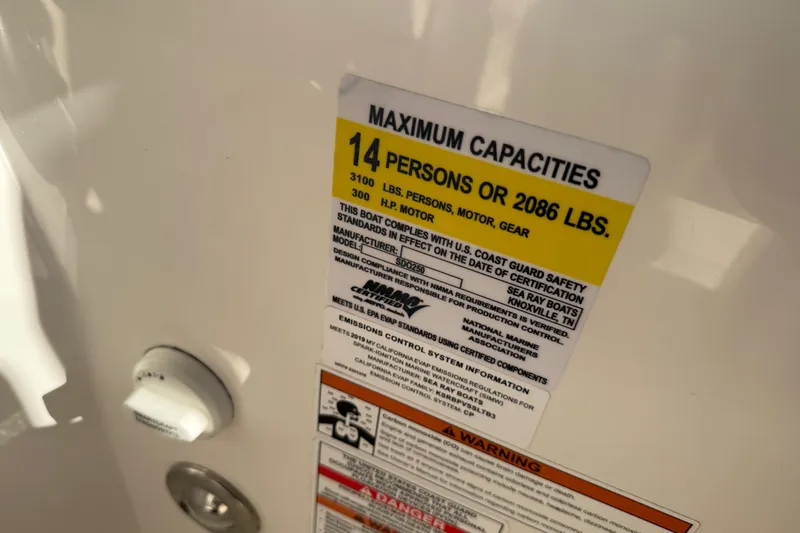 Slide: The Image of 2019 Sea Ray SDX 250 Outboard capacity label, 14 persons or 2086 lbs, safety compliance. - 63
