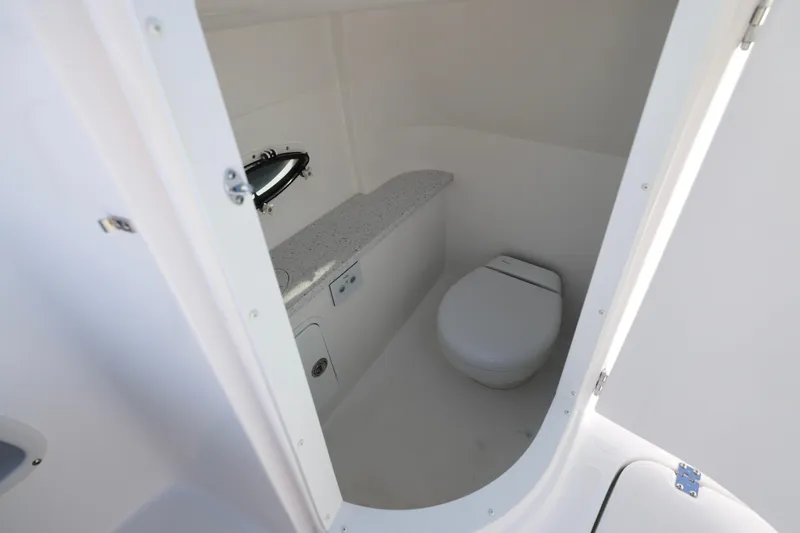 Slide: The Image of 2026 Hurricane SunDeck 2486 OB boat interior with seating and cup holders. - 10