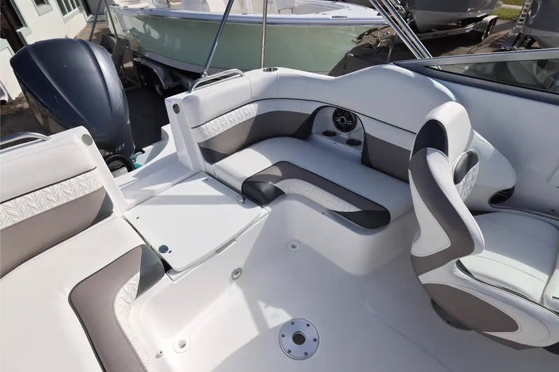 Slide: The Image of Interior of 2026 Hurricane SunDeck 2486 OB boat bathroom with toilet and porthole. - 11