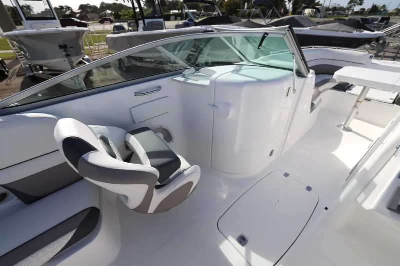 Slide: The Image of 2026 Hurricane SunDeck 2486 OB boat interior with stylish seating and modern design. - 12