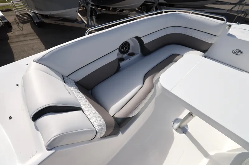 Slide: The Image of 2026 Hurricane SunDeck 2486 OB boat interior with white and gray seating, showcasing luxury design. - 16