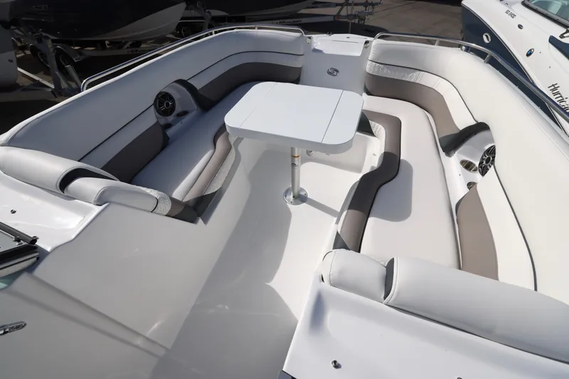 Slide: The Image of 2026 Hurricane SunDeck 2486 OB boat dashboard with steering wheel and control panel. - 4