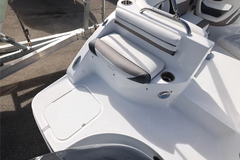 Slide: The Image of 2026 Hurricane SunDeck 2486 OB boat interior with modern helm and seating. - 8