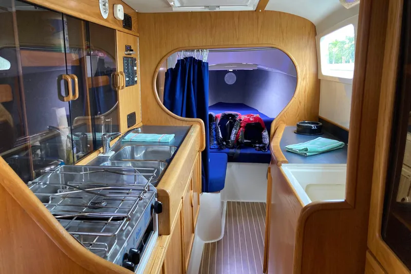 Slide: The Image of Interior of 2009 Seawind 36 1000XL catamaran with kitchen and cabin view. - 25