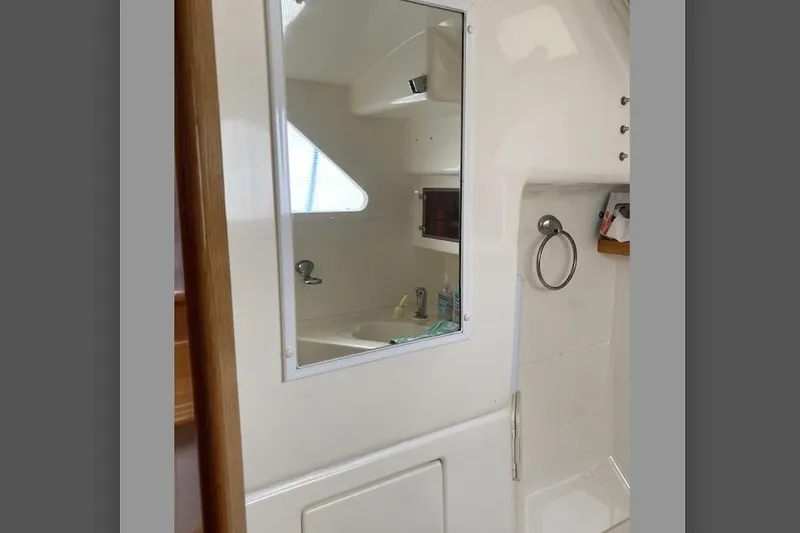 Slide: The Image of Interior of 2009 Seawind 36 1000XL yacht bathroom with mirror and sink. - 34