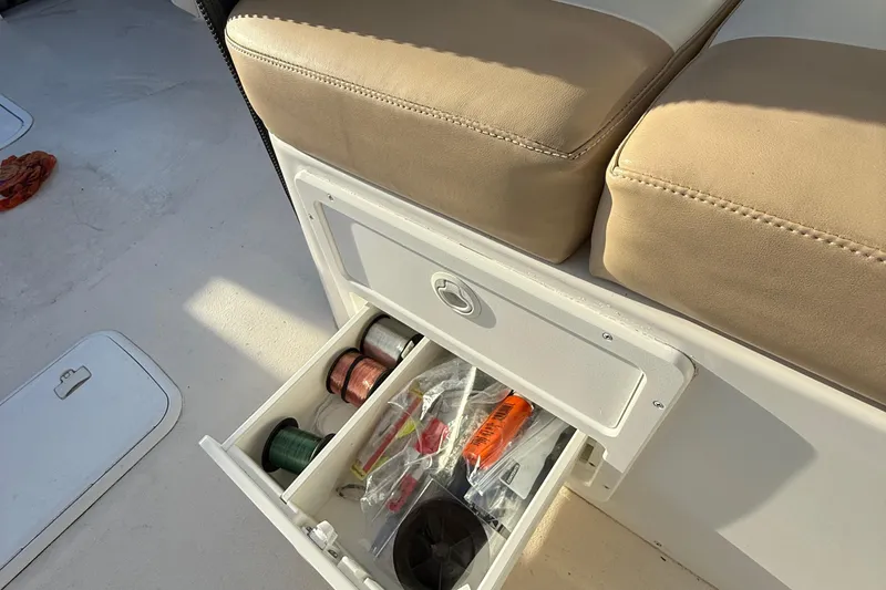 Slide: The Image of Storage drawer with fishing gear on a 2014 Steiger Craft 26' Miami boat. - 16