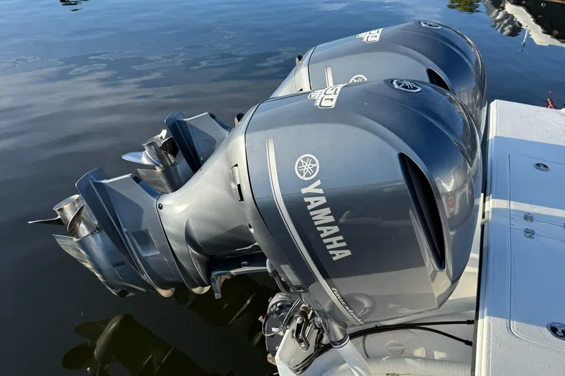 Slide: The Image of Twin Yamaha outboard engines on a 2014 Steiger Craft 26' Miami boat. - 22