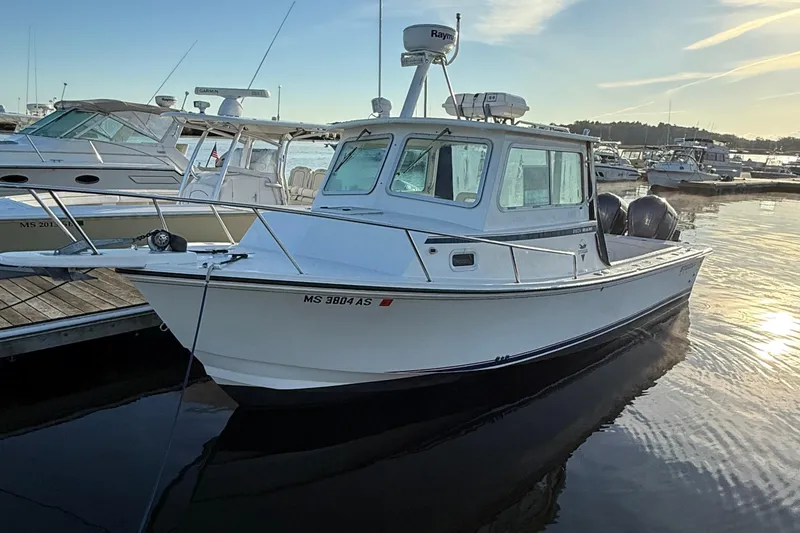 Slide: The Image of 2014 Steiger Craft 26' Miami boat docked at marina during sunset. - 3