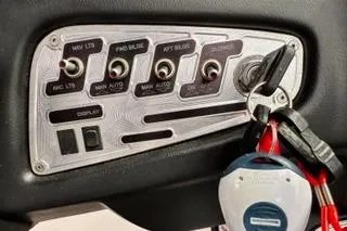 Slide: The Image of Control panel of a 2009 MasterCraft X-15 boat with ignition keys. - 21