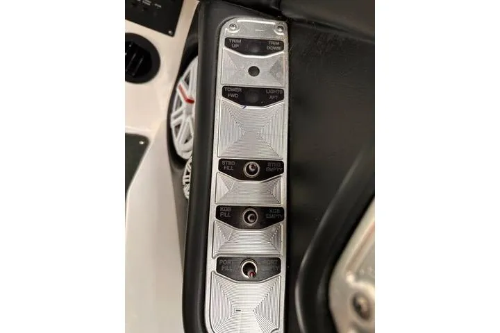 Slide: The Image of Control panel of a 2009 MasterCraft X-15 boat with various switches and buttons. - 22