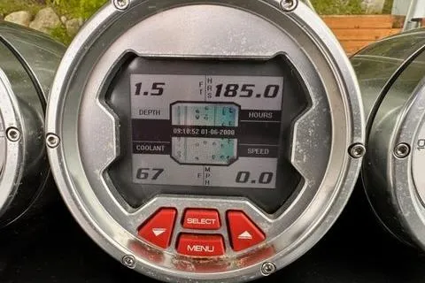 Slide: The Image of 2009 MasterCraft X-15 dashboard display showing depth, hours, coolant, and speed metrics. - 7