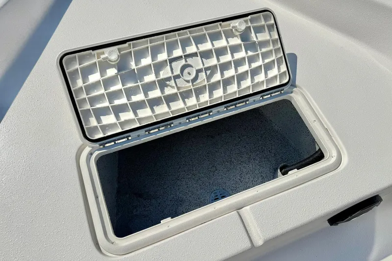 Slide: The Image of Open storage compartment on 2025 Carolina Skiff EV198 Sea Skiff boat. - 12