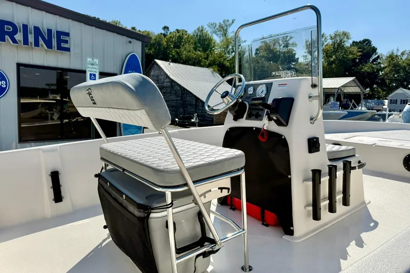 Slide: The Image of 2025 Carolina Skiff EV198 Sea Skiff interior with steering console and seating. - 18
