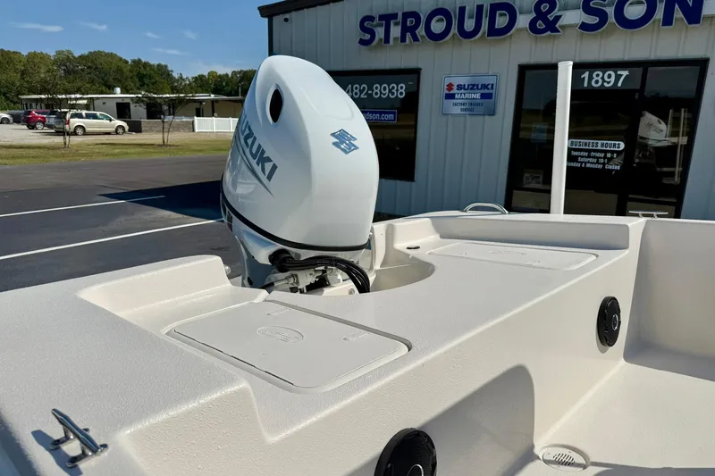 Slide: The Image of 2025 Carolina Skiff EV198 Sea Skiff with Suzuki outboard motor at dealership. - 24