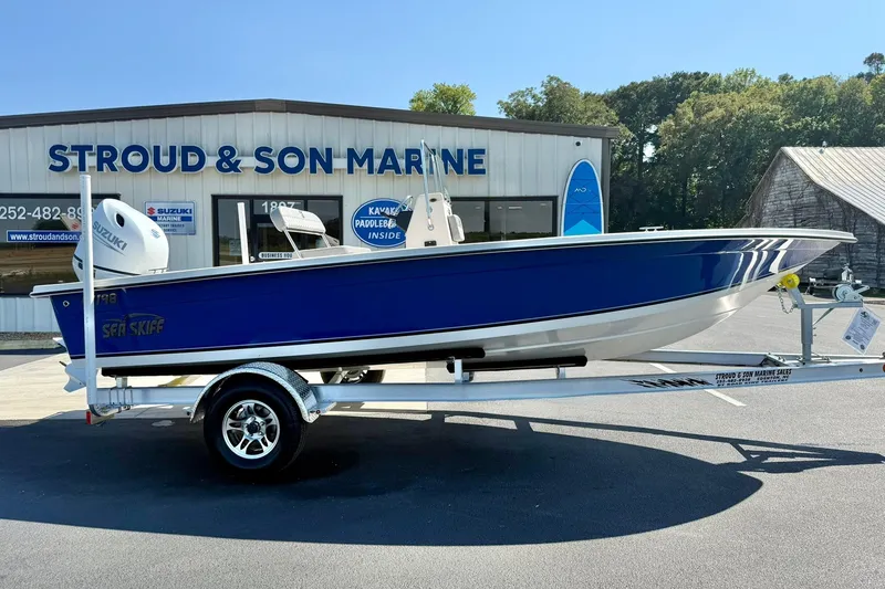 Slide: The Image of 2025 Carolina Skiff EV198 Sea Skiff in blue on trailer at Stroud & Son Marine. - 7