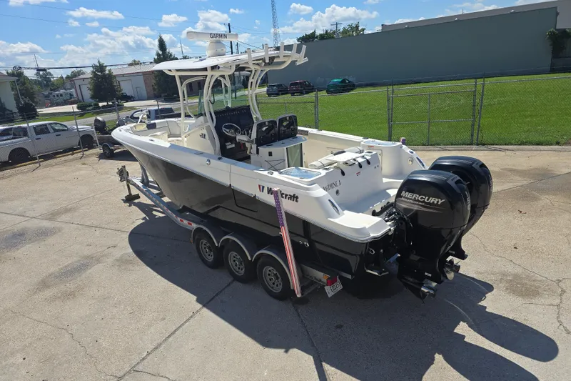 Slide: The Image of 2019 Wellcraft 262 Fisherman boat with dual Mercury engines on a trailer. - 3