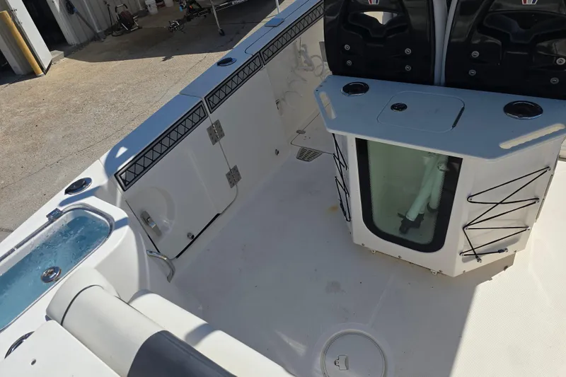 Slide: The Image of 2019 Wellcraft 262 Fisherman boat interior with livewell and storage compartments. - 6