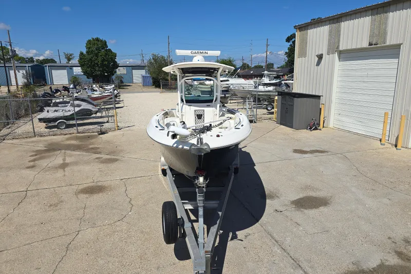 Slide: The Image of 2019 Wellcraft 262 Fisherman boat on trailer in a marina storage area. - 8