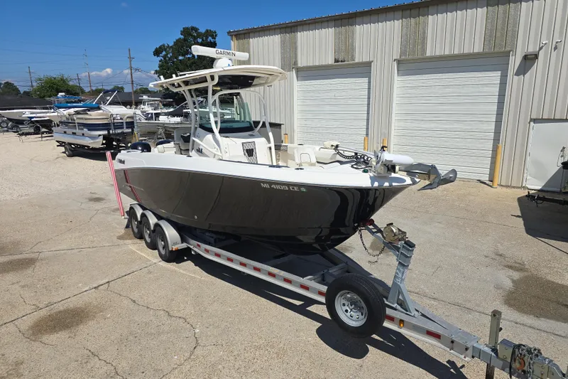 Slide: The Image of 2019 Wellcraft 262 Fisherman boat on trailer outside storage facility. - 9