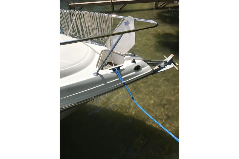 Slide: The Image of 2005 Chaparral Signature 260 boat anchored in clear shallow water. - 14