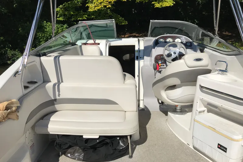 Slide: The Image of 2005 Chaparral Signature 260 boat interior with seating and steering wheel. - 7