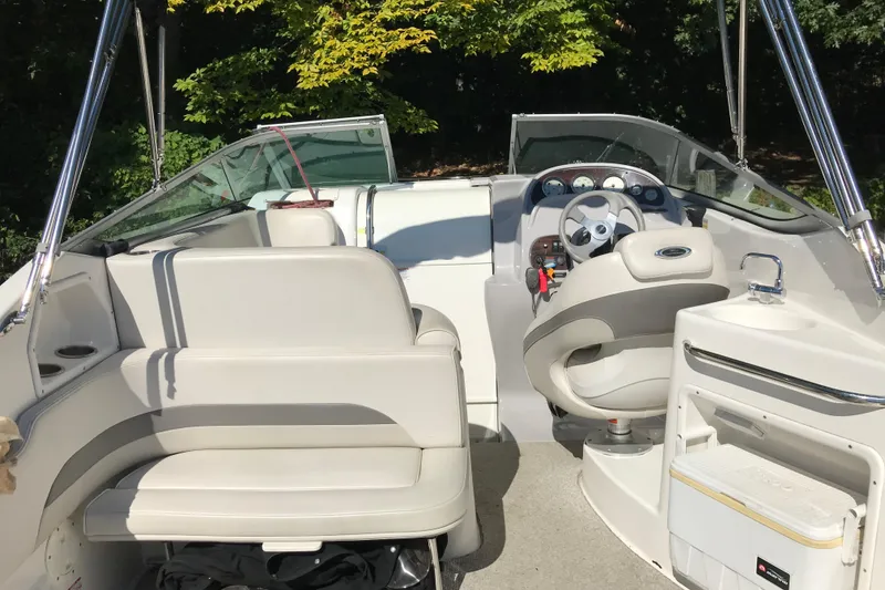 Slide: The Image of 2005 Chaparral Signature 260 boat interior with seating and steering wheel. - 8