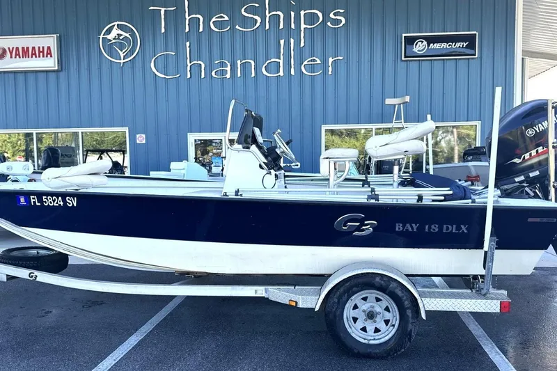 Slide: The Image of 2017 G3 Bay 18 DLX boat on trailer at The Ships Chandler dealership. - 12