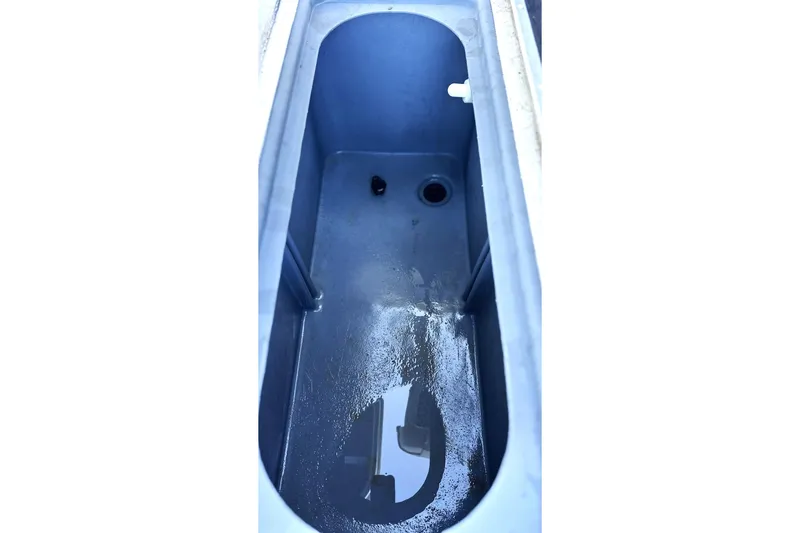 Slide: The Image of 2017 G3 Bay 18 DLX boat livewell interior with water drainage. - 5