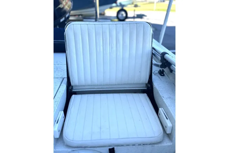 Slide: The Image of White cushioned seat on 2017 G3 Bay 18 DLX boat, open position. - 6