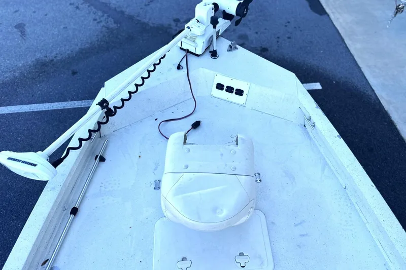 Slide: The Image of 2017 G3 Bay 18 DLX boat deck with trolling motor and storage compartment. - 7