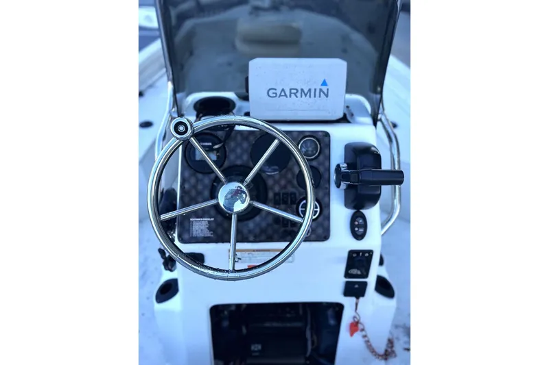 Slide: The Image of 2017 G3 Bay 18 DLX boat console with Garmin navigation system and steering wheel. - 9