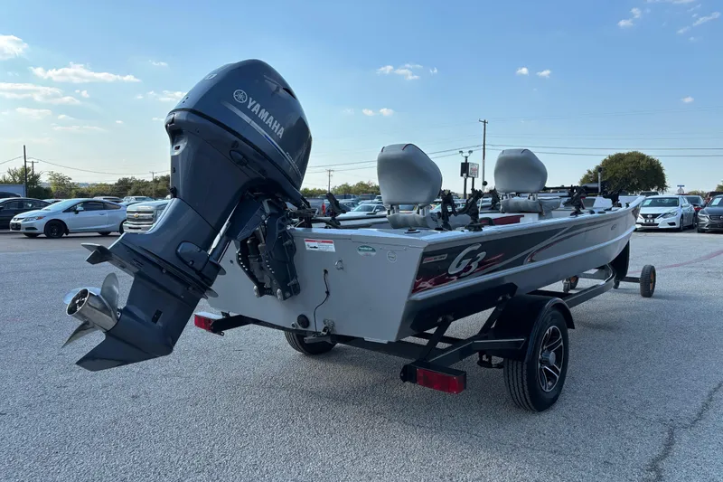 Slide: The Image of 2017 G3 Eagle 170 PFX fishing boat with dual seats and motor, parked outdoors. - 20