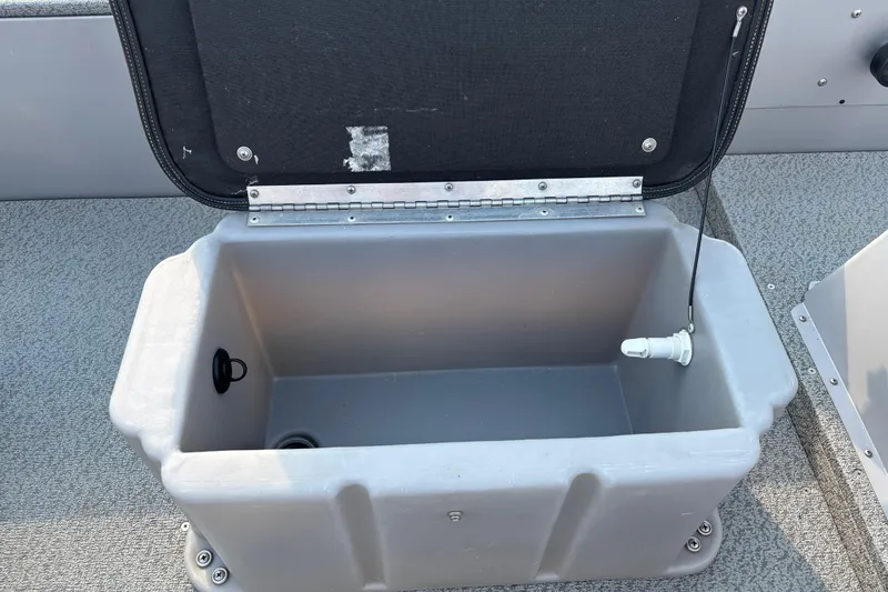 Slide: The Image of 2017 G3 Eagle 170 PFX boat interior with rod holders and fire extinguisher. - 22