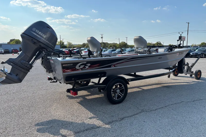 Slide: The Image of Open storage compartment in 2017 G3 Eagle 170 PFX boat with MotorGuide manual. - 25