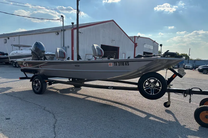 Slide: The Image of 2017 G3 Eagle 170 PFX boat on trailer, parked outside a warehouse. - 26
