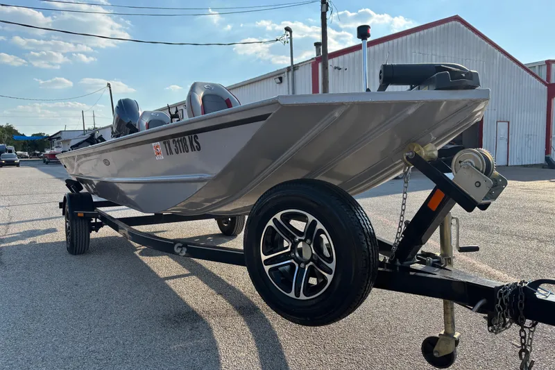 Slide: The Image of 2017 G3 Eagle 170 PFX boat on trailer, parked outdoors near a building. - 27