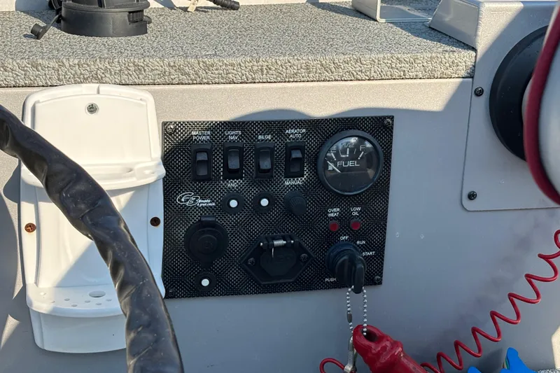 Slide: The Image of Control panel of a 2017 G3 Eagle 170 PFX boat with switches and fuel gauge. - 30