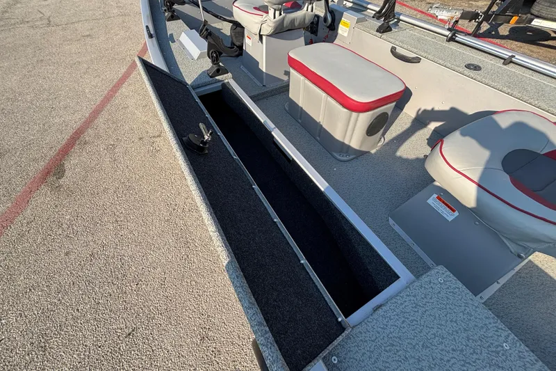 Slide: The Image of 2017 G3 Eagle 170 PFX boat interior with open storage compartment and seating. - 31