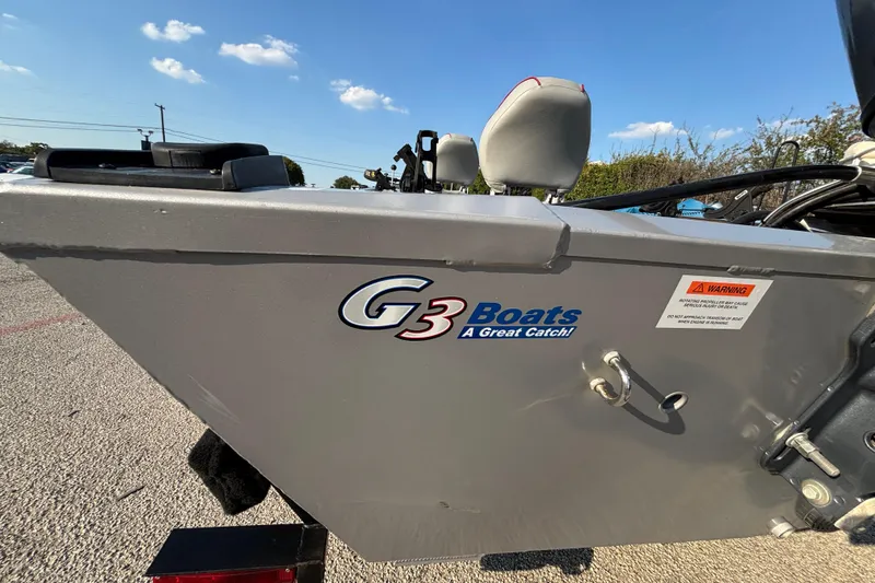 Slide: The Image of 2017 G3 Eagle 170 PFX boat with logo and warning label, under clear blue sky. - 39