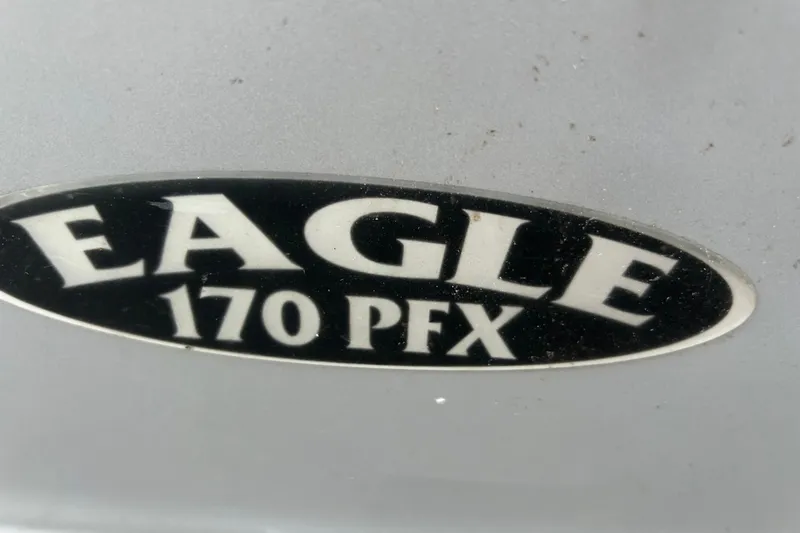 Slide: The Image of 2017 G3 Eagle 170 PFX boat on trailer, parked outdoors, clear sky background. - 4