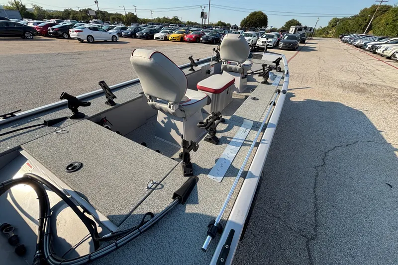 Slide: The Image of 2017 G3 Eagle 170 PFX boat with seating, rod holders, and storage, parked in a lot. - 41