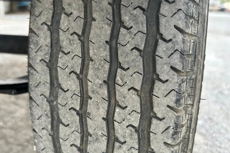 Slide: The Image of 2017 G3 Eagle 170 PFX boat on trailer, parked outdoors under a clear sky. - 6