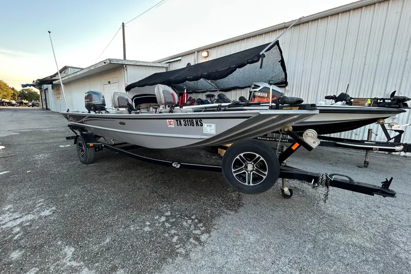 Slide: The Image of 2017 G3 Eagle 170 PFX boat on trailer, parked outside a building. - 8