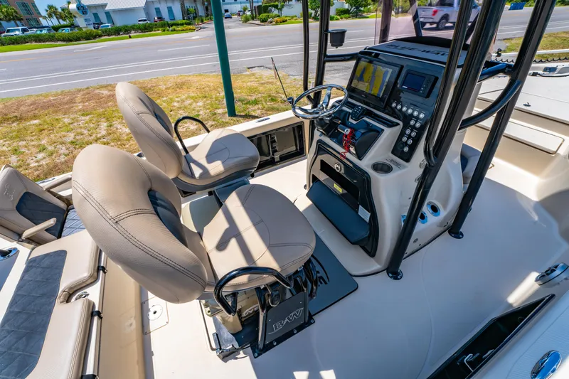 Slide: The Image of Interior of 2020 Blue Wave 2400 PureBay boat with dual seats and control panel. - 15