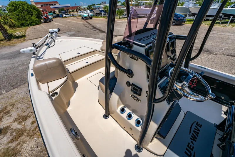 Slide: The Image of 2020 Blue Wave 2400 PureBay boat interior with steering console and seating. - 16