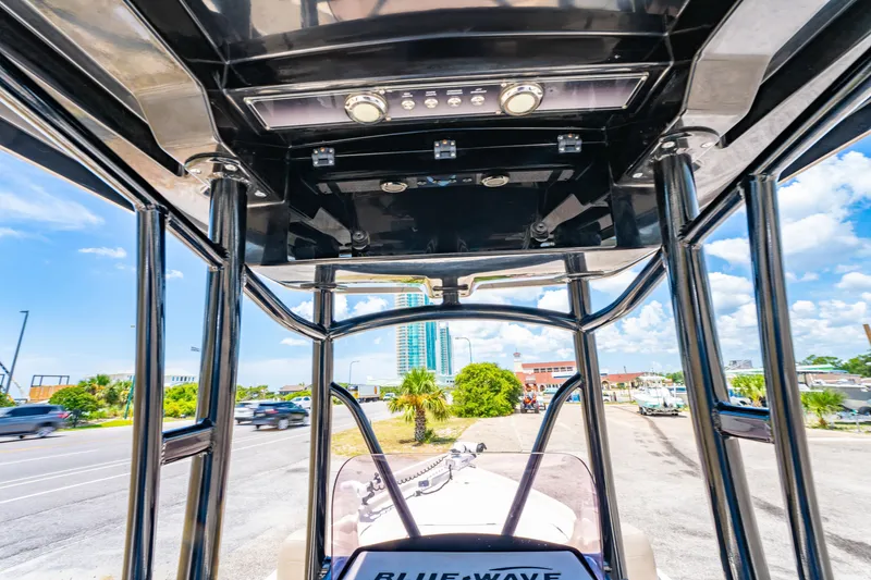 Slide: The Image of 2020 Blue Wave 2400 PureBay boat interior with cityscape view in the background. - 22