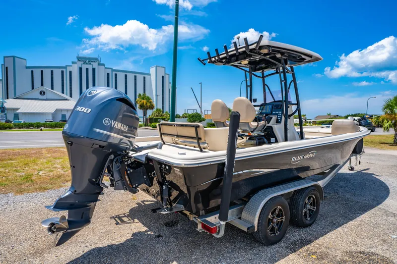 Slide: The Image of 2020 Blue Wave 2400 PureBay boat with Yamaha engine on trailer, sunny day. - 5