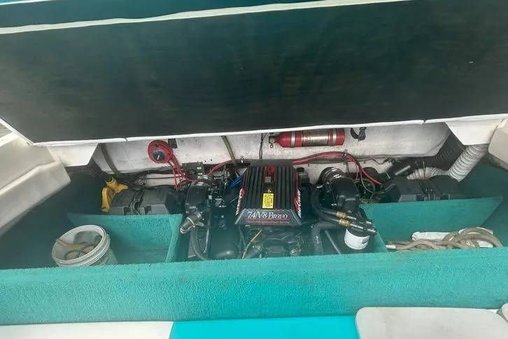 Slide: The Image of Engine compartment of a 1991 Wellcraft 216 Eclipse boat, featuring a 7.4L V8 Bravo engine. - 11