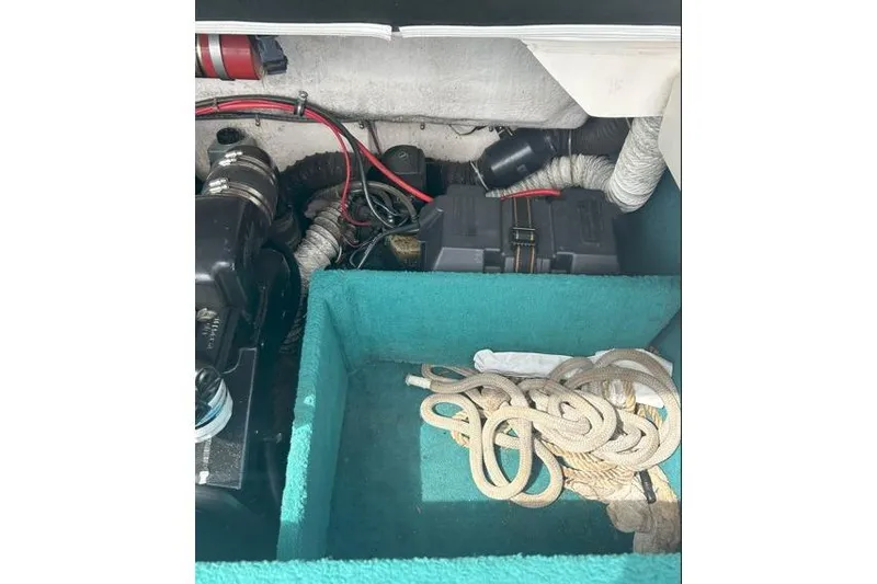 Slide: The Image of Interior view of a 1991 Wellcraft 216 Eclipse boat showing engine compartment and ropes. - 15