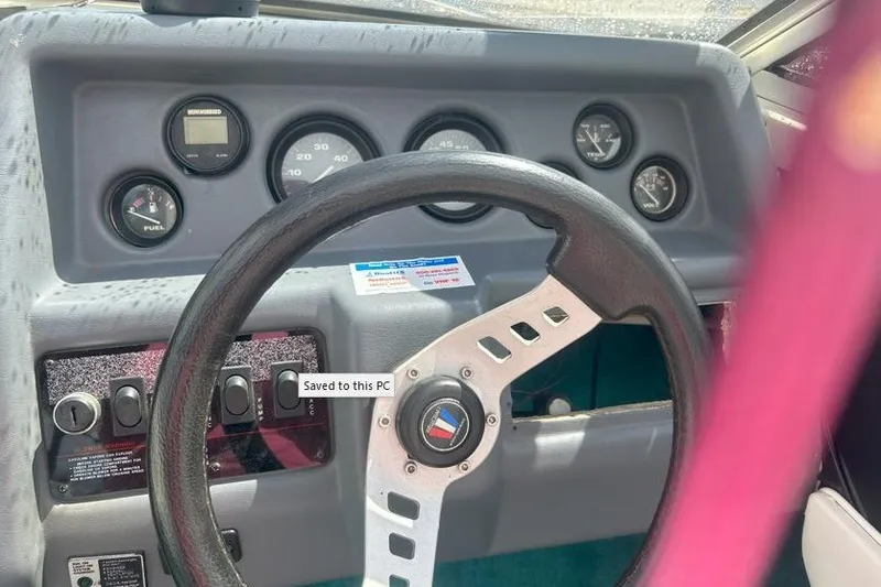 Slide: The Image of 1991 Wellcraft 216 Eclipse dashboard with steering wheel and instrument gauges. - 4